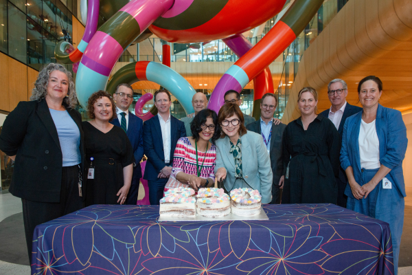 Group picture of the RCH and Austin Health staff at the event with the cake